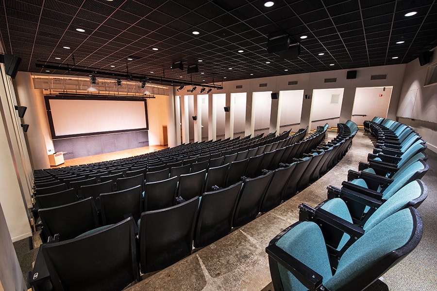Photo of McConomy Auditorium with a view from the audience area, looking towards the stage
